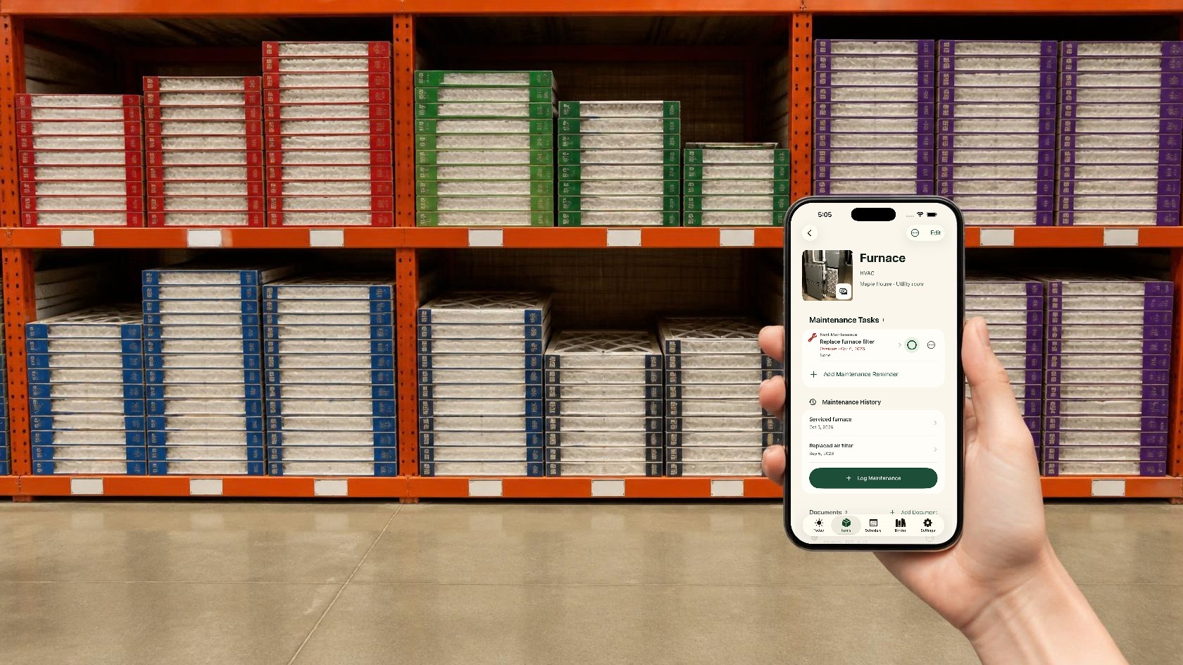 A hand holding an iPhone with the real Around The House furnace record open in a store aisle of air filters.